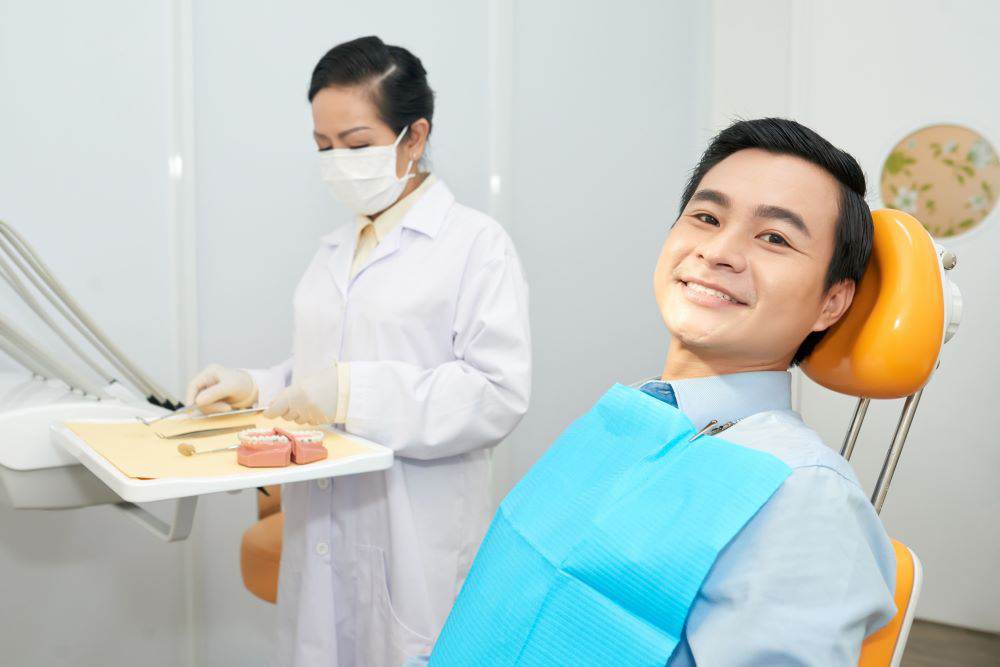 smiling-ethnic-man-in-dental-chair