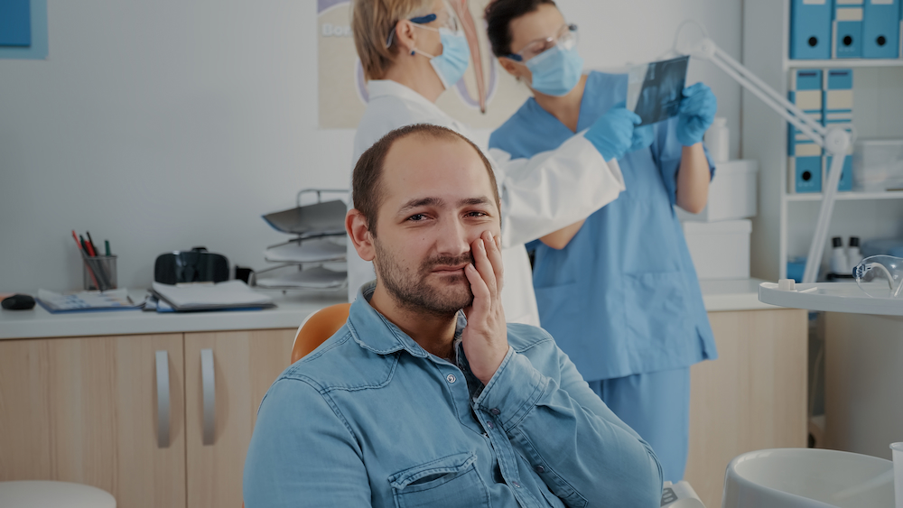 portrait of patient with toothache looking at came 2022 03 10 17 10 07 utc 1