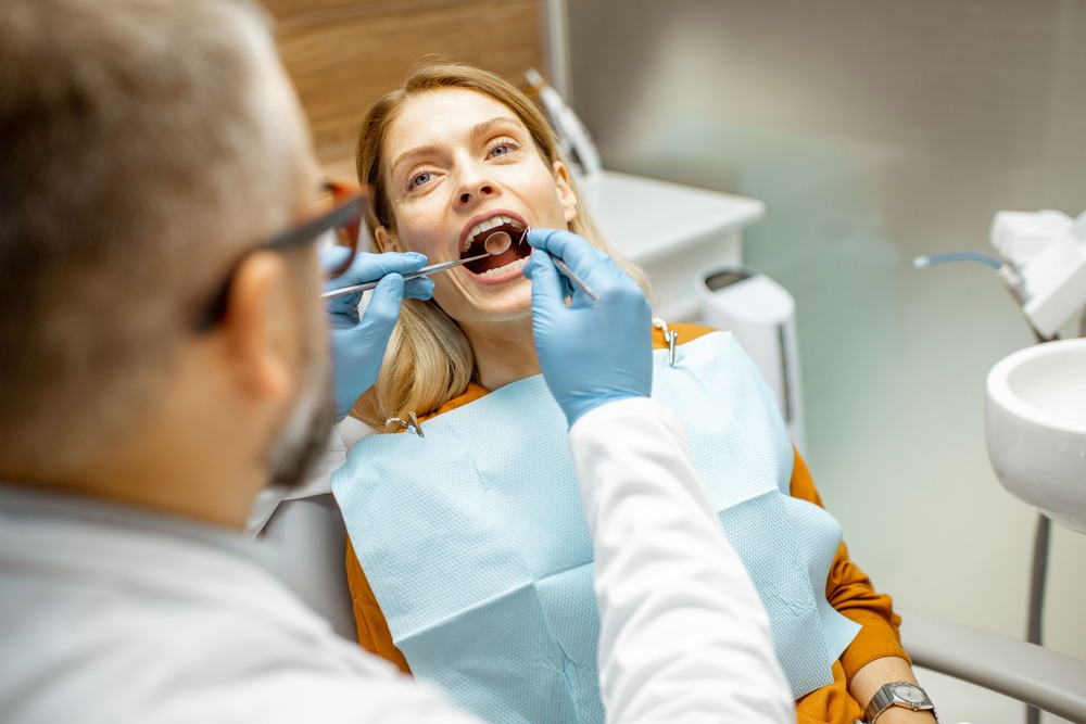 woman during a teeth inspection at the dental offi 2022 01 18 23 45 29 utc 1